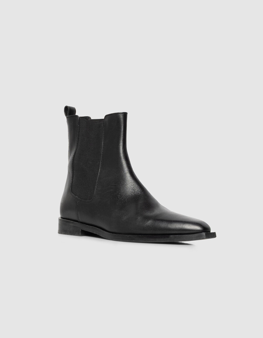 botas chelsea de piel negra con punta puntiaguda para mujer