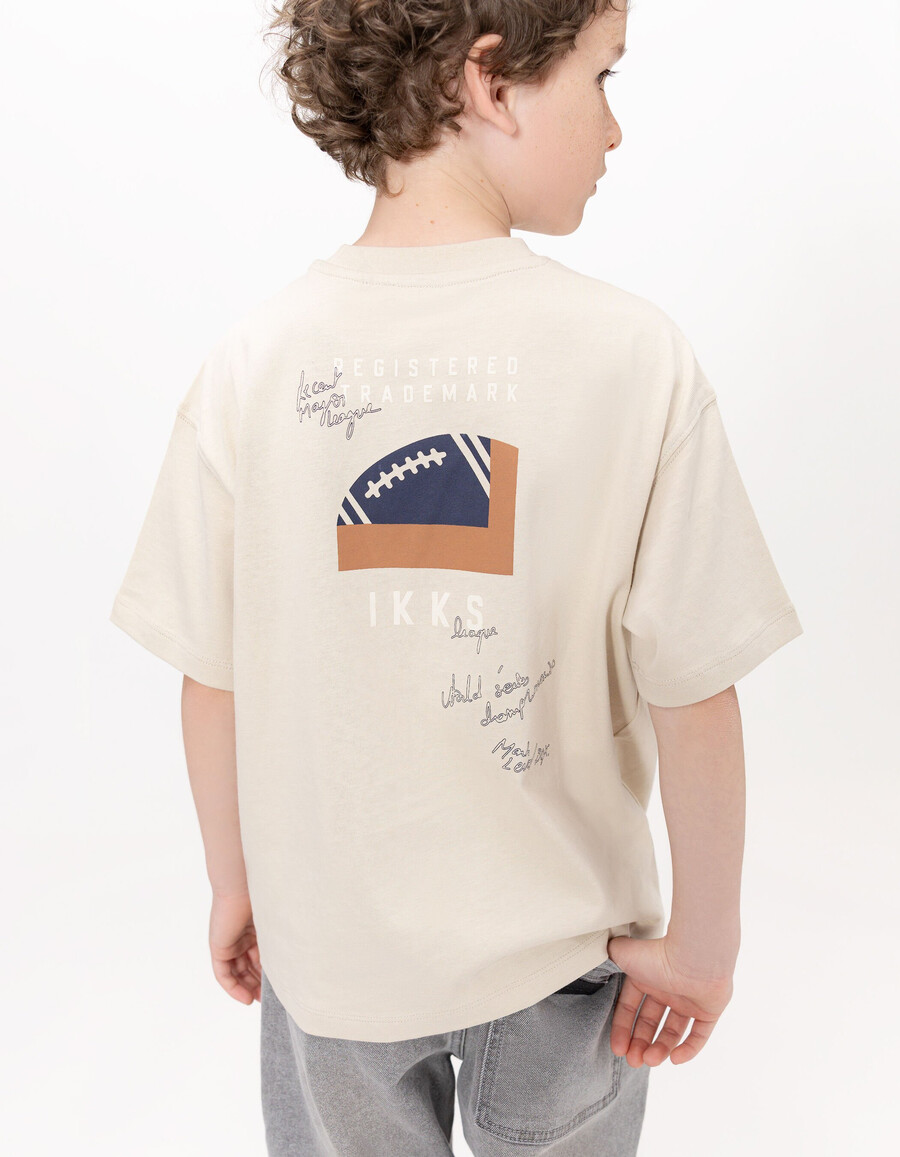 camiseta de algodón orgánico beige para niño bolsillo talla xl imagen trasera