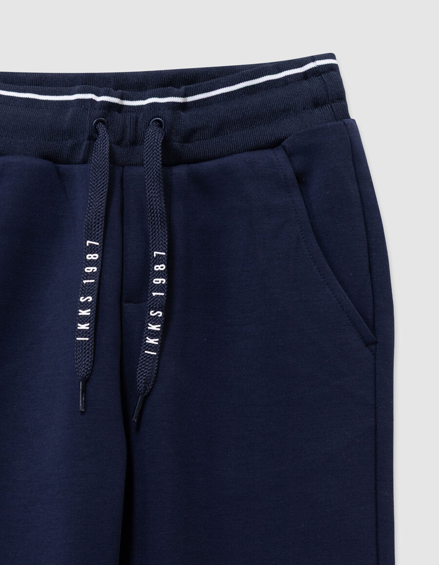 pantalones deportivos azul marino con cordón ajustable con letras para niño