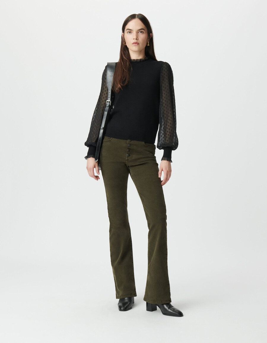 suéter de punto negro para mujer con mangas de voile suizo con lunares