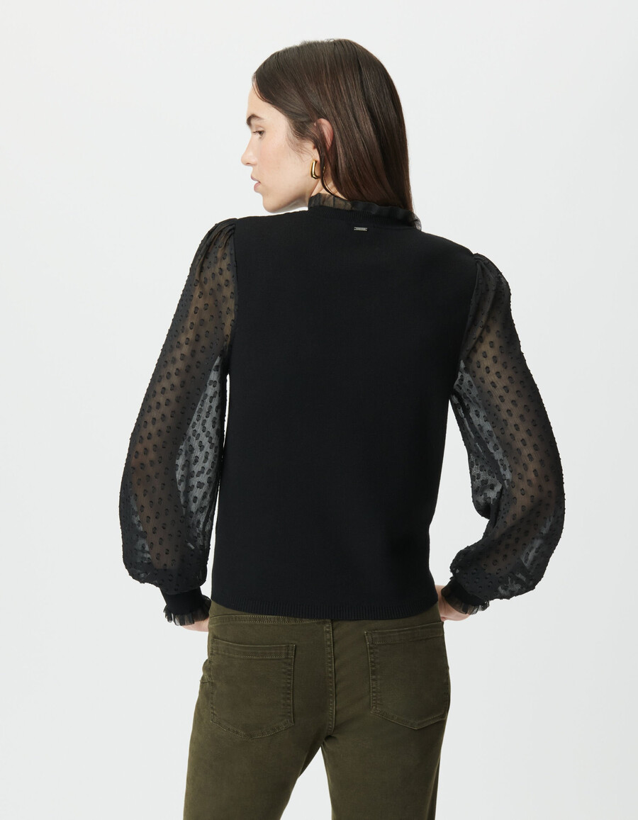 suéter de punto negro para mujer con mangas de voile suizo con lunares
