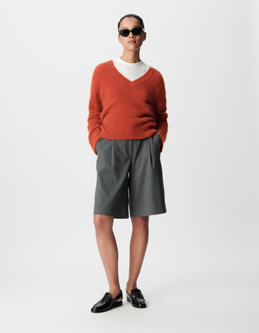 suéter naranja oversize con cuello en v para mujer