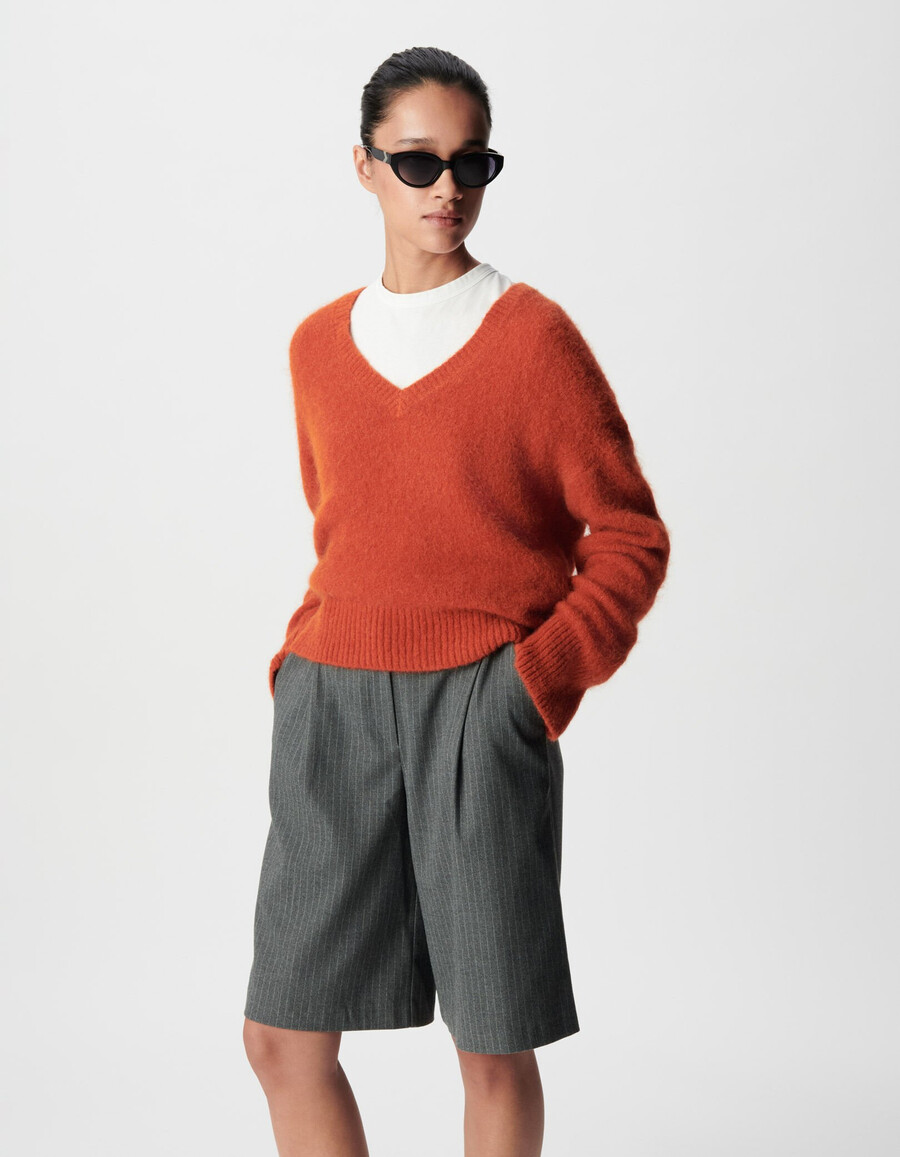suéter naranja oversize con cuello en v para mujer