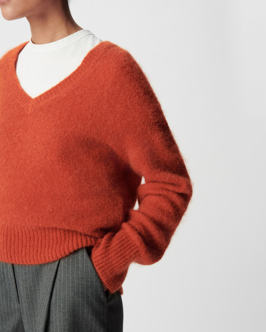 suéter naranja oversize con cuello en v para mujer