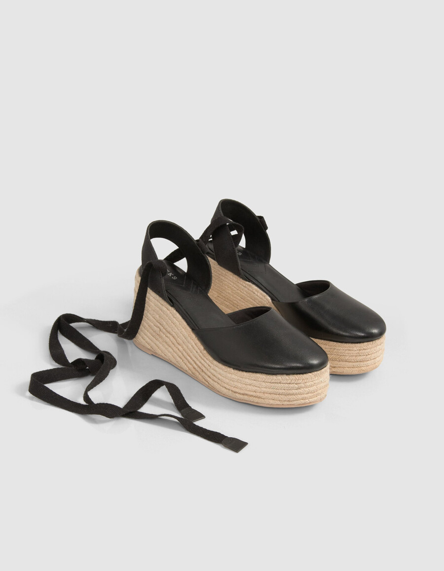 alpargatas de plataforma con cordones de cuero negro para mujer