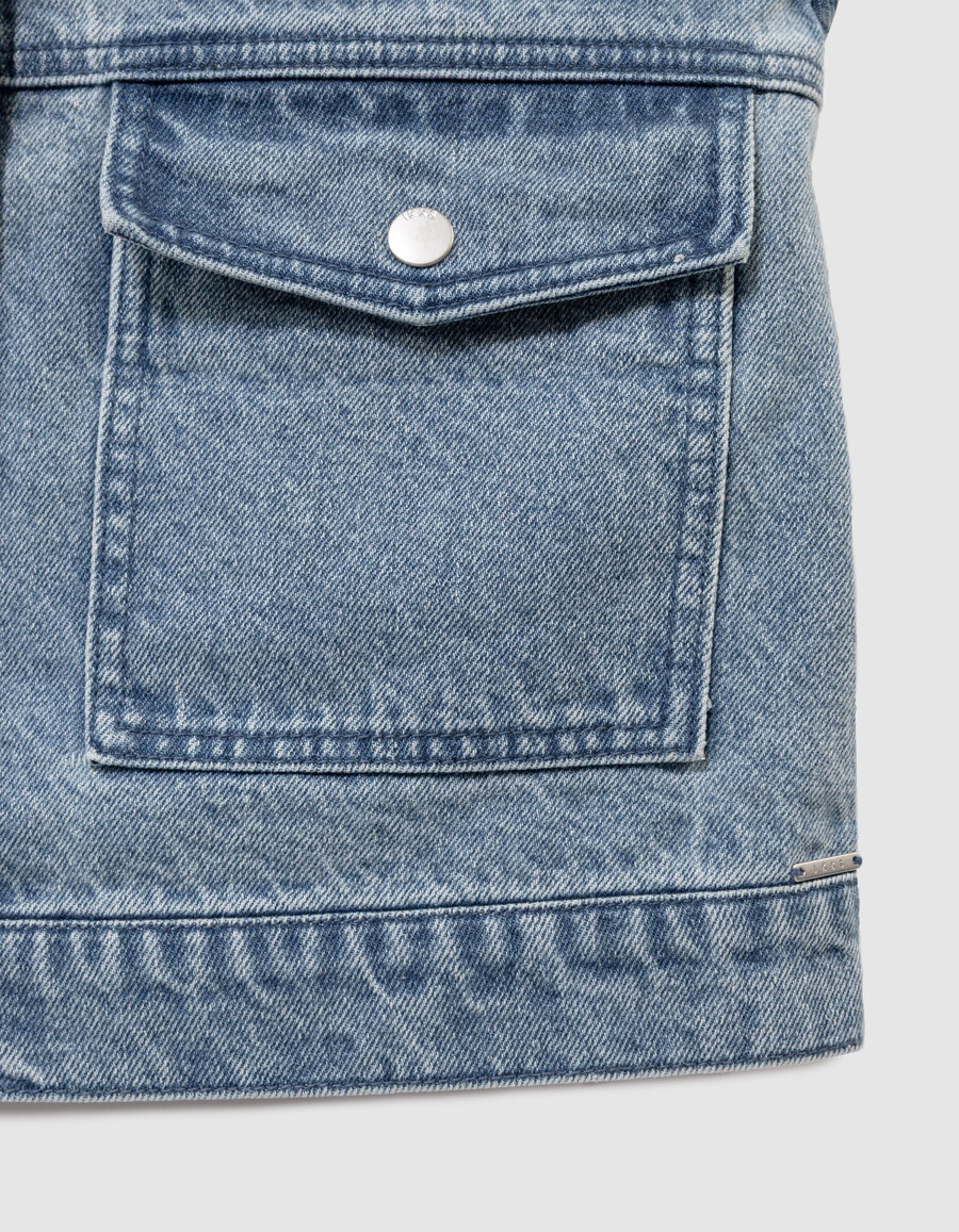 chaqueta vaquera azul sin mangas para niña