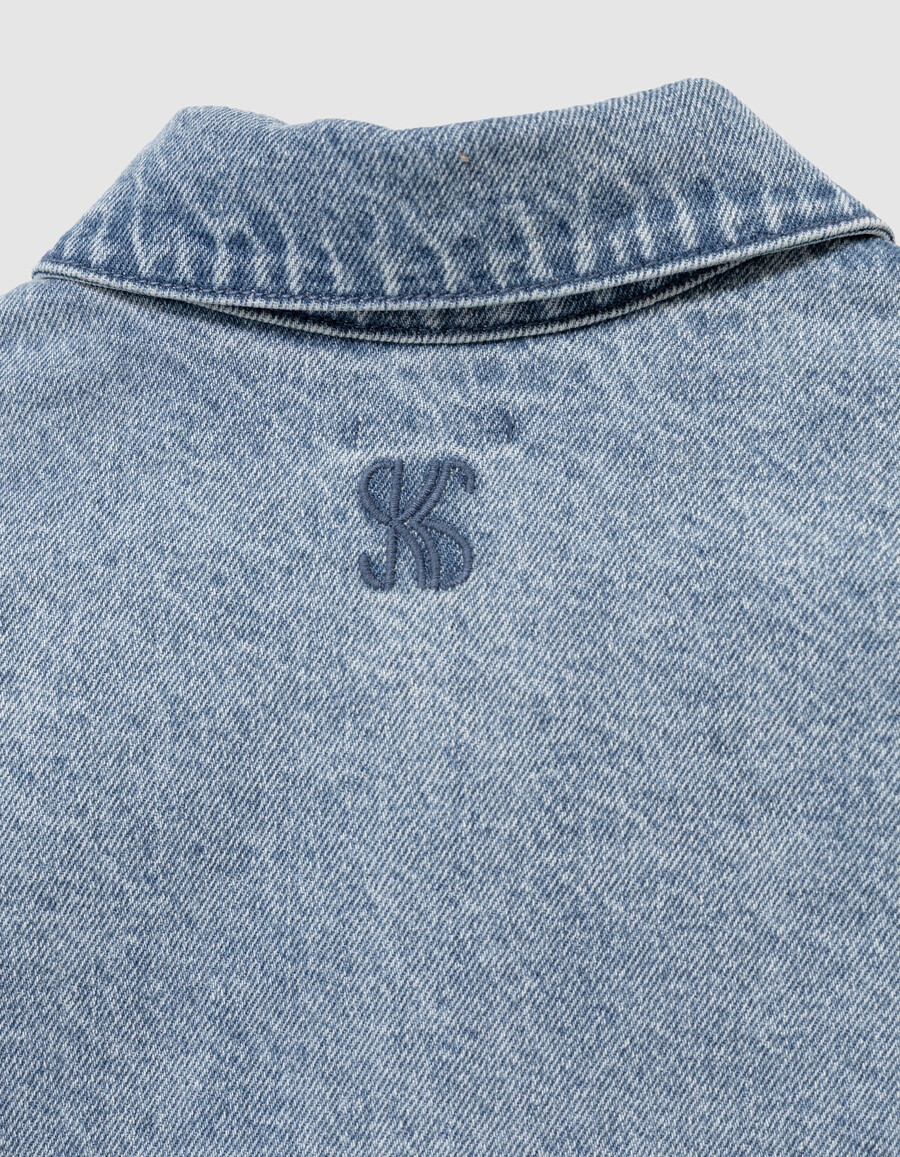 chaqueta vaquera azul sin mangas para niña