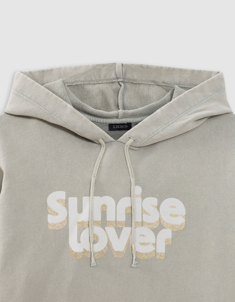 sudadera corta verde con mensaje brillante para niña