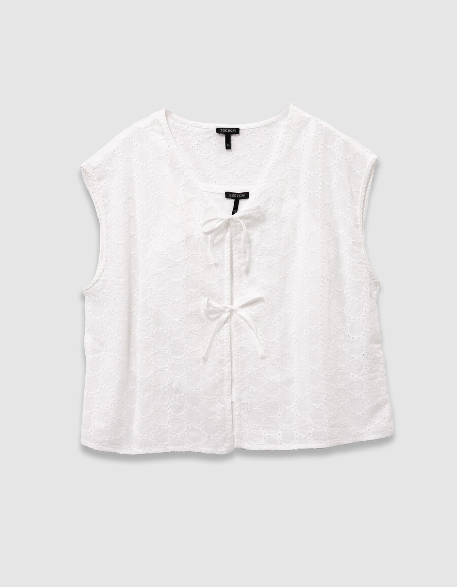 camisa blanca de encaje sin mangas para niña con lazo en la parte delantera