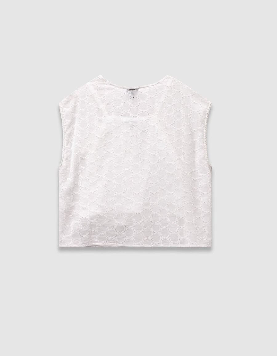 camisa blanca de encaje sin mangas para niña con lazo en la parte delantera
