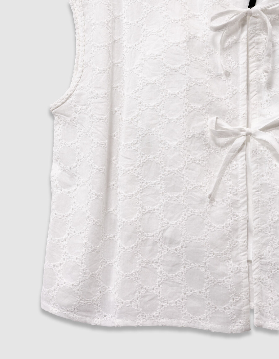 camisa blanca de encaje sin mangas para niña con lazo en la parte delantera