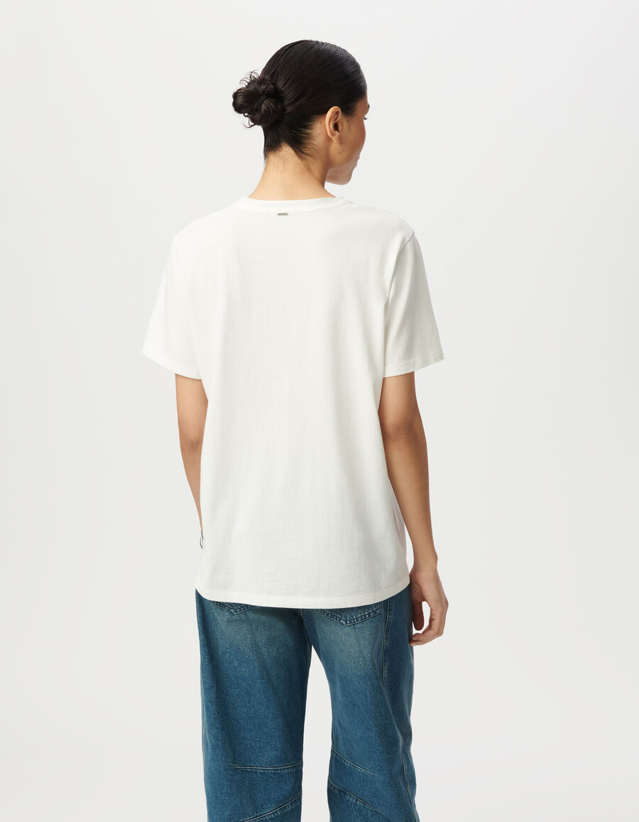 camiseta blanca de mujer con eslogan de purpurina negra