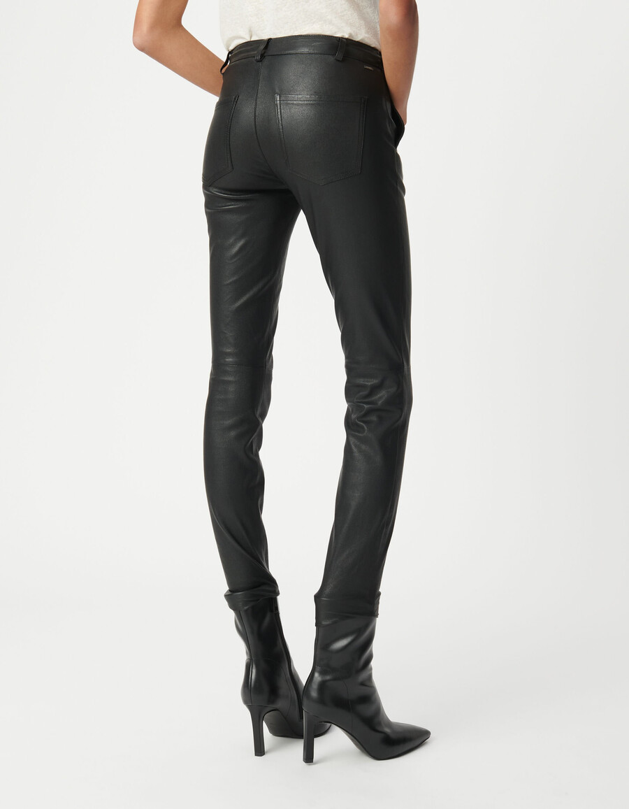 pantalones de motociclista ajustados de cuero negro para mujer