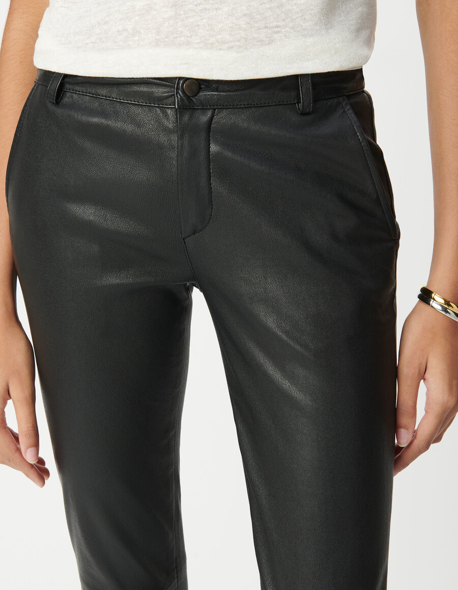 pantalones de motociclista ajustados de cuero negro para mujer